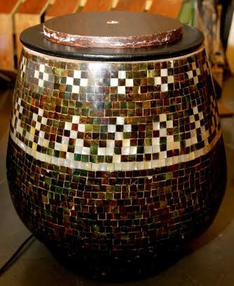 SMALLER but taller version of a stool-cum-side-table is made of mussel shells; mother-of-pearl and resin.